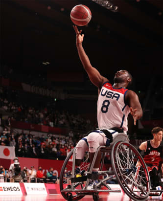 A member of the men's wheelchair basketball team makes a shot during a match at the Tokyo 2020 Paralympic Games.